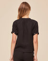 Rear view of black short sleeve shirt