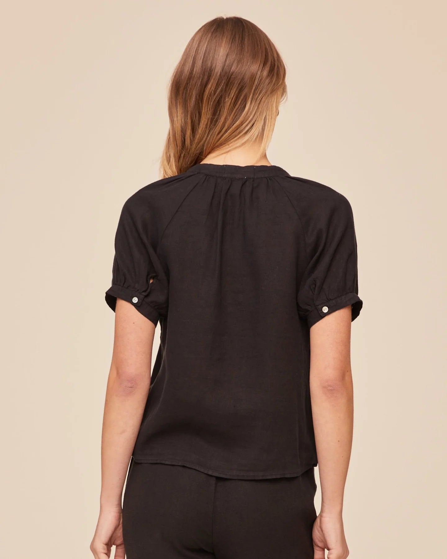 Rear view of black short sleeve shirt