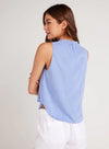 Cornflower blue sleeveless top with stand up collar and edge to edge button fastening