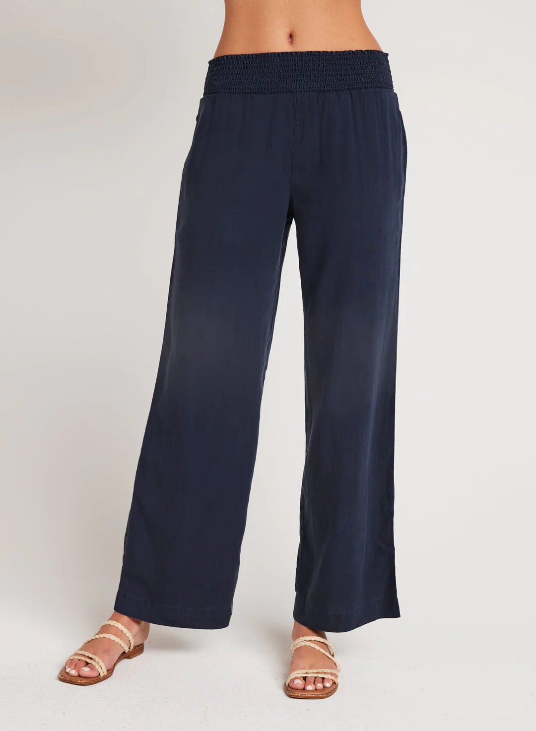 Navy smocked waisted wide leg trousers