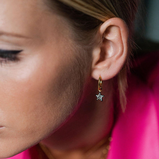 Gold hoops with pave diamond pendants