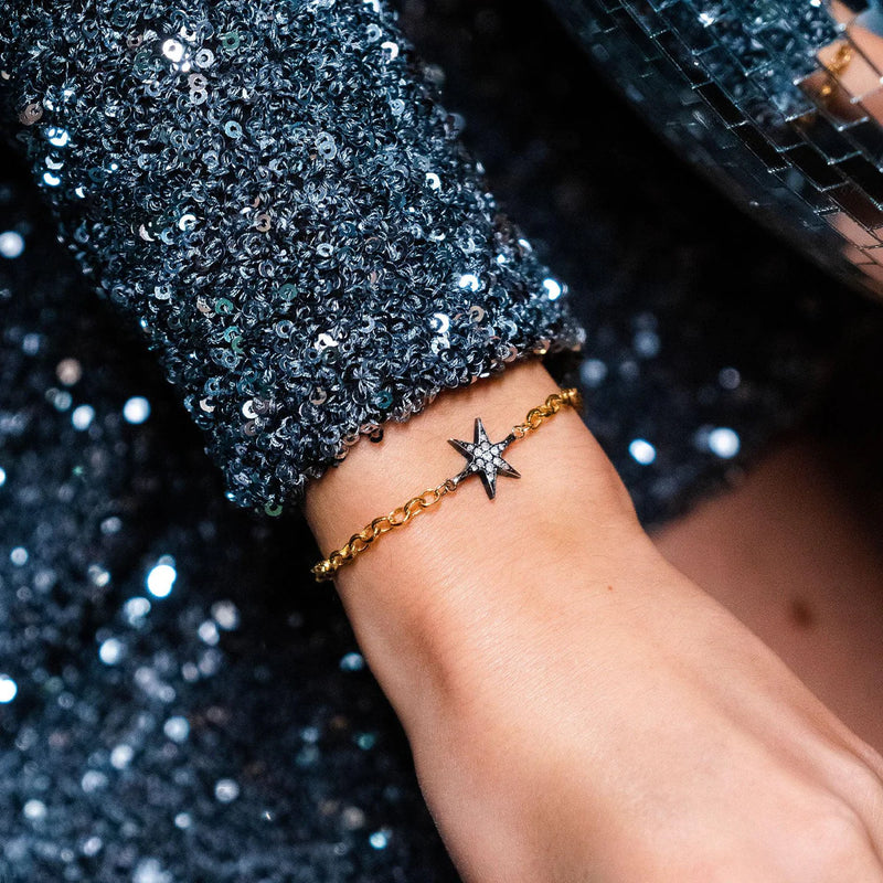 Gold belcher chain bracelet with pave diamond star