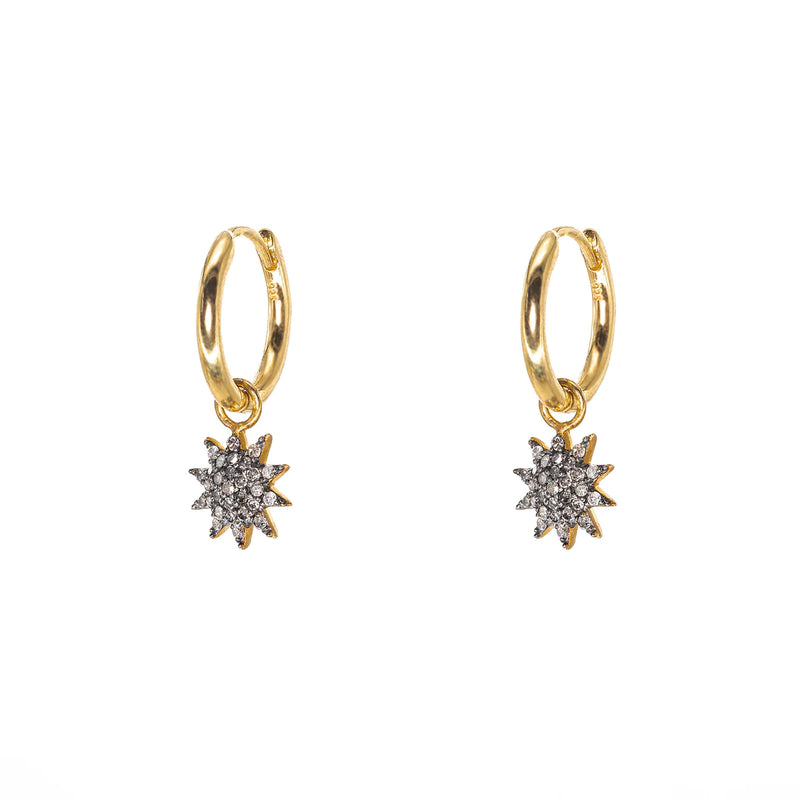Starburst gold hoop earrings with pave diamonds