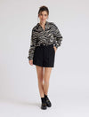 Zebra print shirt with long sleeves and a curved dropped hem