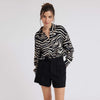 Zebra print shirt with long sleeves and a curved dropped hem 