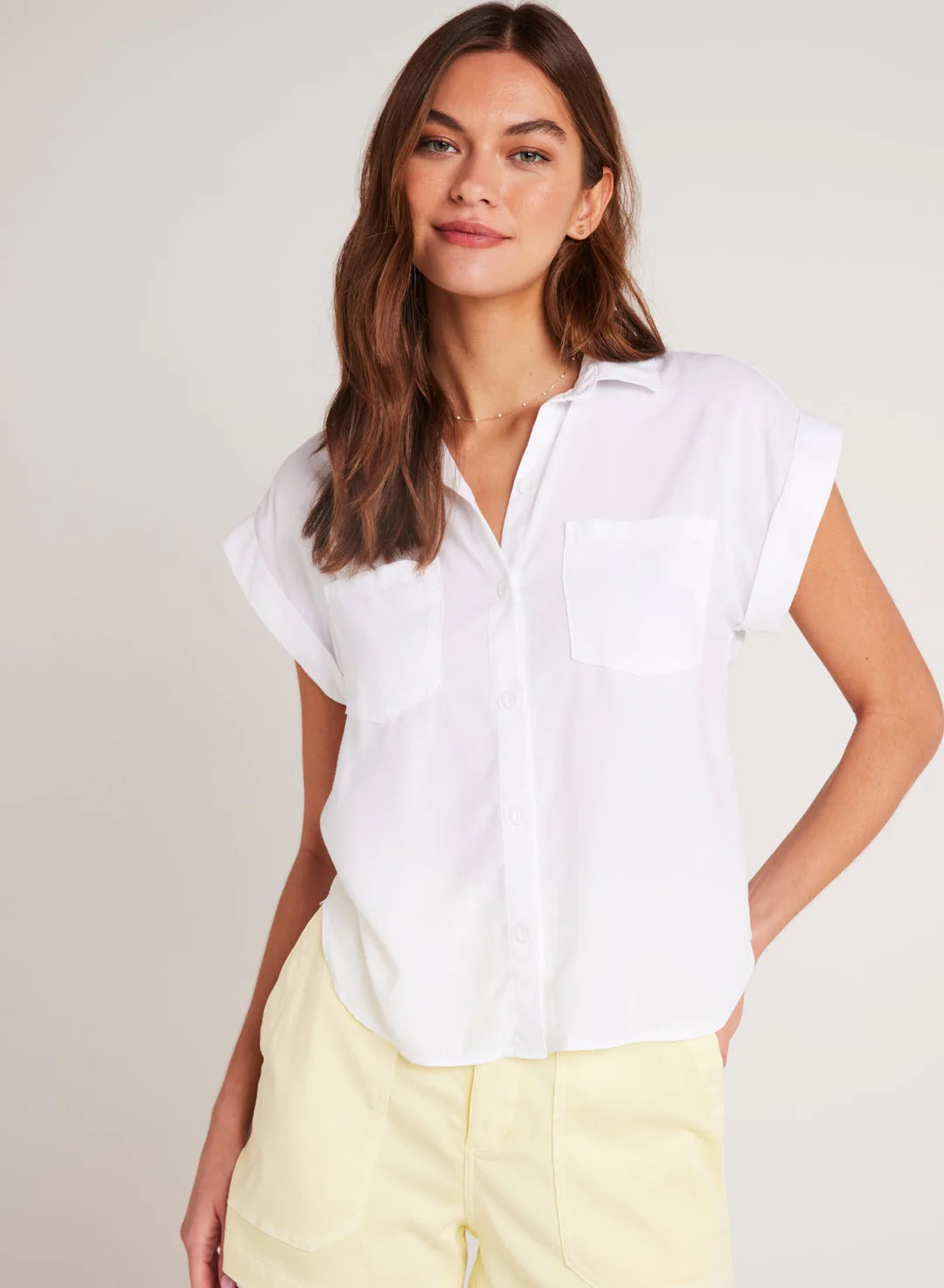 Short sleeved white shirt with grown sleeve and turn up cuffs