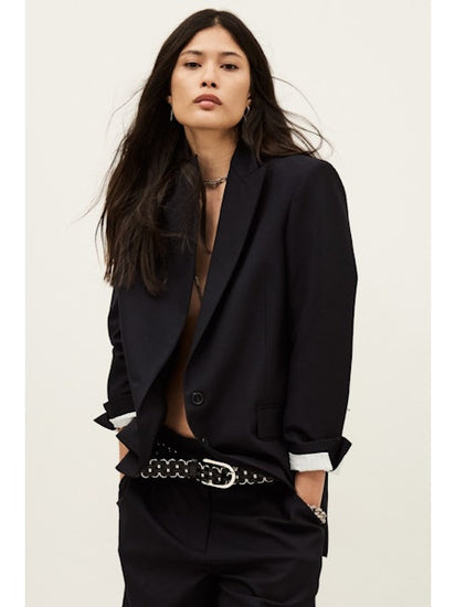 Woman wearing single breasted navy blazer from ba&sh