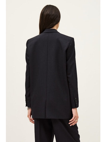 rear view of navy single breasted blazer with rear vent from ba&sh