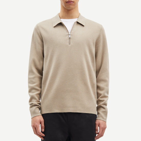 beige half zip polo jumper with classic collar and long sleeves model shot