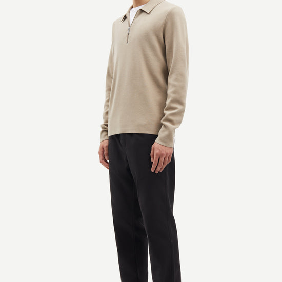 beige half zip polo jumper with classic collar and long sleeves  side view