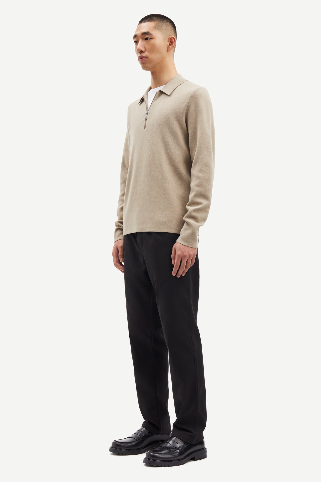 beige half zip polo jumper with classic collar and long sleeves  side view