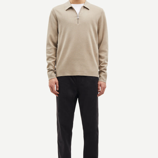 beige half zip polo jumper with classic collar and long sleeves model shot