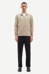 beige half zip polo jumper with classic collar and long sleeves model shot