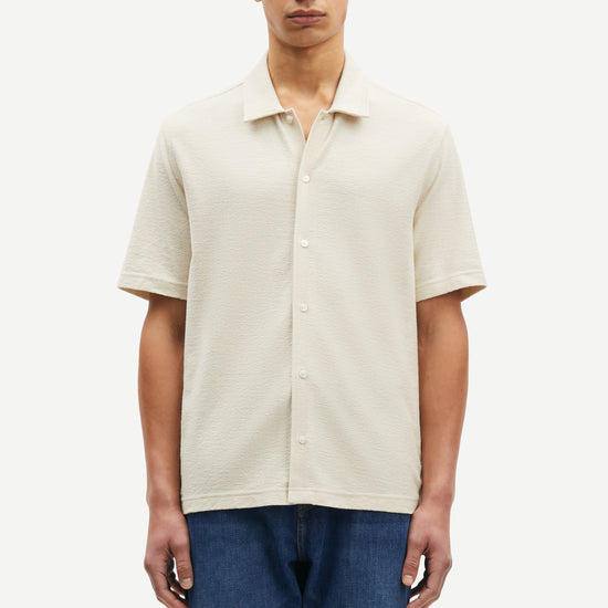 oatmeal short sleeved shirt with point collar in a slubbed textured material model shot