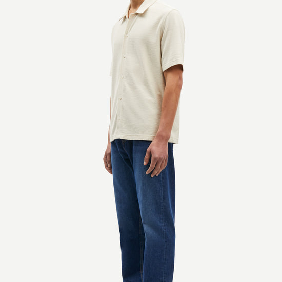 oatmeal short sleeved shirt with point collar in a slubbed textured material side view 