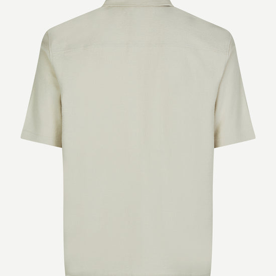 oatmeal short sleeved shirt with point collar in a slubbed textured material rear view 