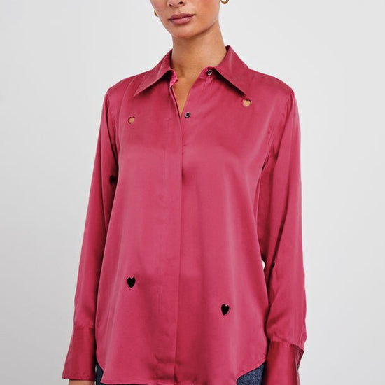 Model shot of pink silk shirt with heart cut out detail