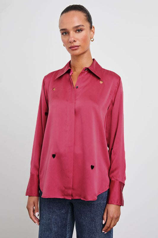 Model shot of pink silk shirt with heart cut out detail