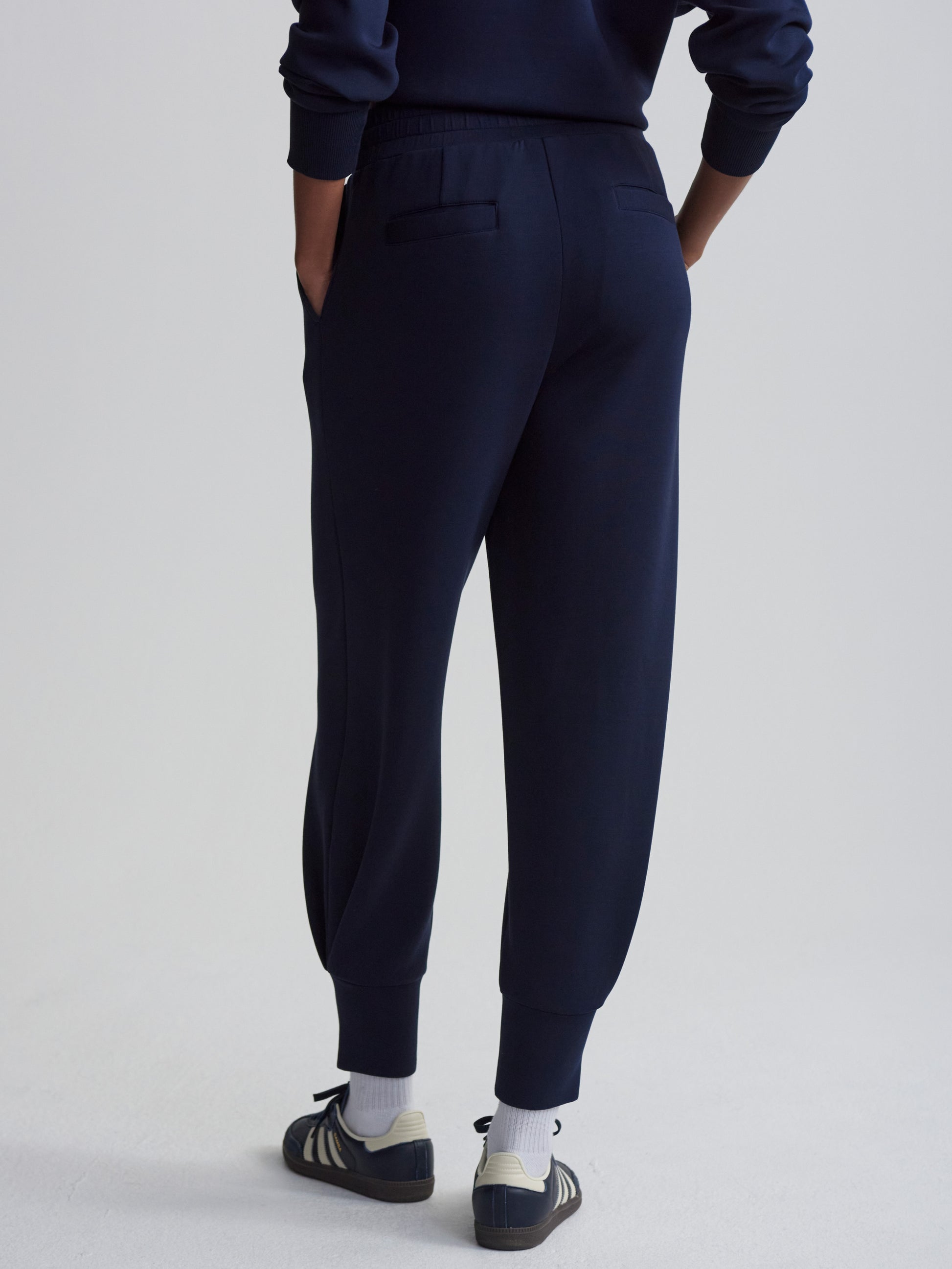 Rear view of the deep cuff navy jogging bottom