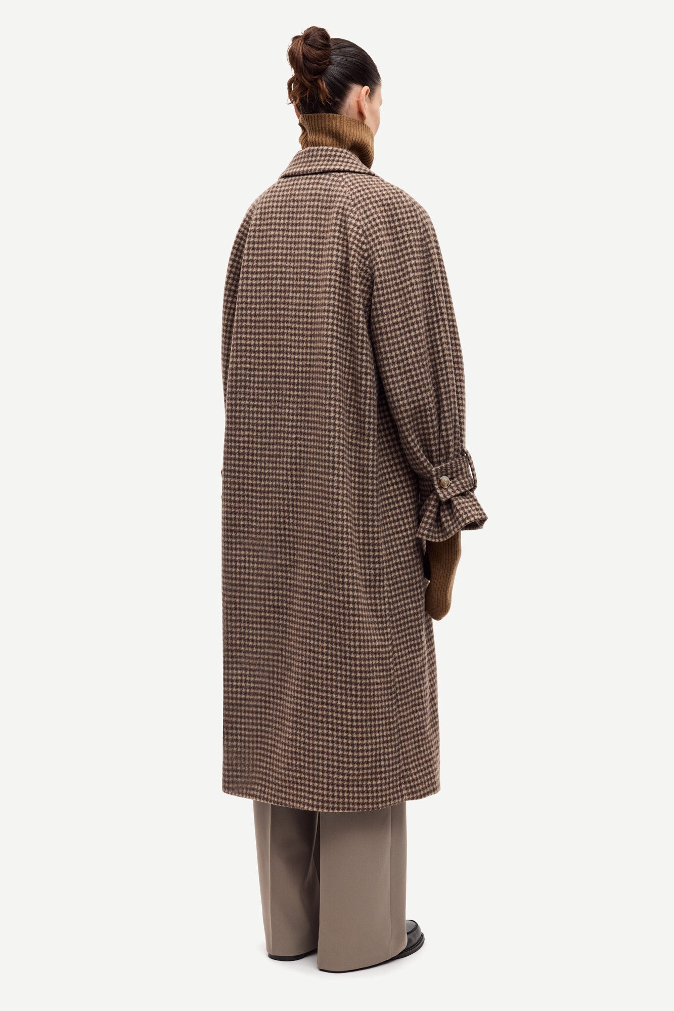 oversized brown check winter coat with wide sleeves with belted cuffs and concealed placket  rear view