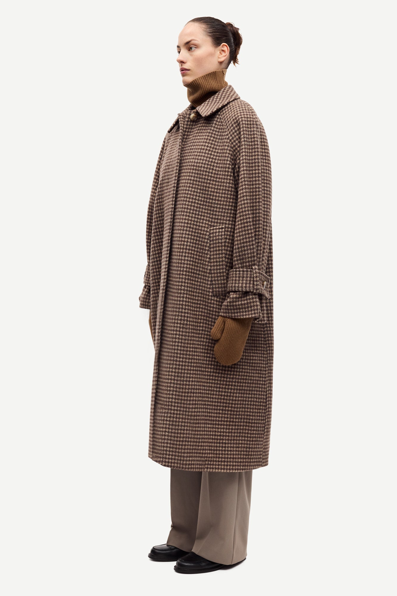 oversized brown check winter coat with wide sleeves with belted cuffs and concealed placket  side view 