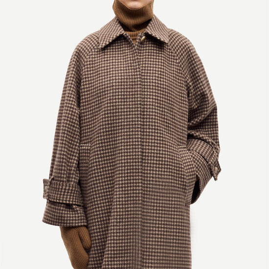 oversized brown check winter coat with wide sleeves with belted cuffs and concealed placket  model shot