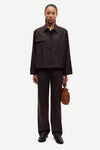 brown tailored trousers with pleated front, concealed fastening and straight fit model shot