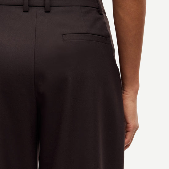 brown tailored trousers with pleated front, concealed fastening and straight fit rear view close up