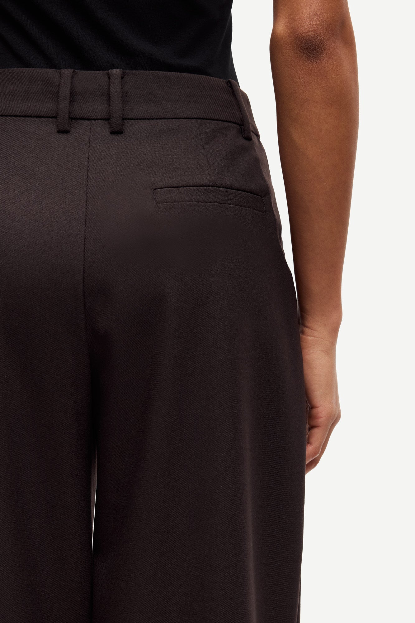 brown tailored trousers with pleated front, concealed fastening and straight fit rear view close up