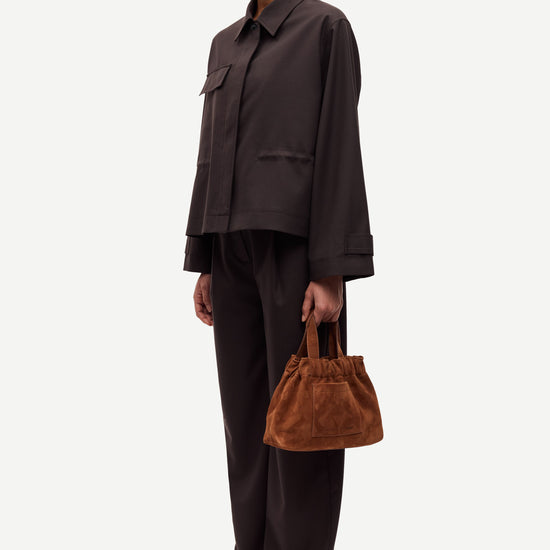 brown tailored trousers with pleated front, concealed fastening and straight fit side view