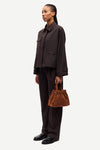 brown tailored trousers with pleated front, concealed fastening and straight fit side view
