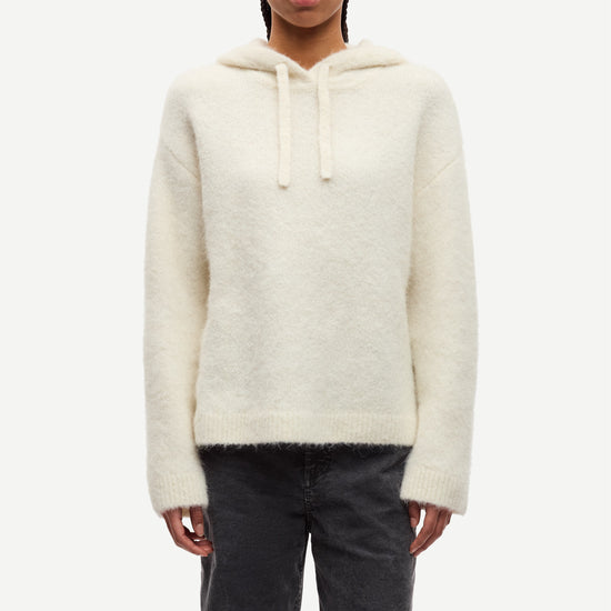 cream hoodie with drawstring neck and rub detailing model shot