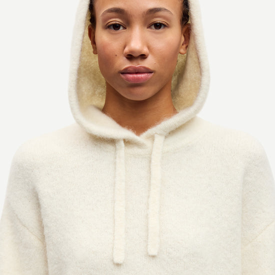 cream hoodie with drawstring neck and rub detailing close up