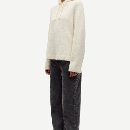 cream hoodie with drawstring neck and rub detailing side view 