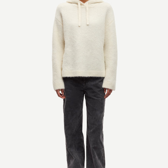 cream hoodie with drawstring neck and rub detailing model shot