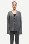 long sleeve grey wool cardigan with dark grey buttons and rib detailing model shot