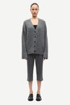 long sleeve grey wool cardigan with dark grey buttons and rib detailing model shot
