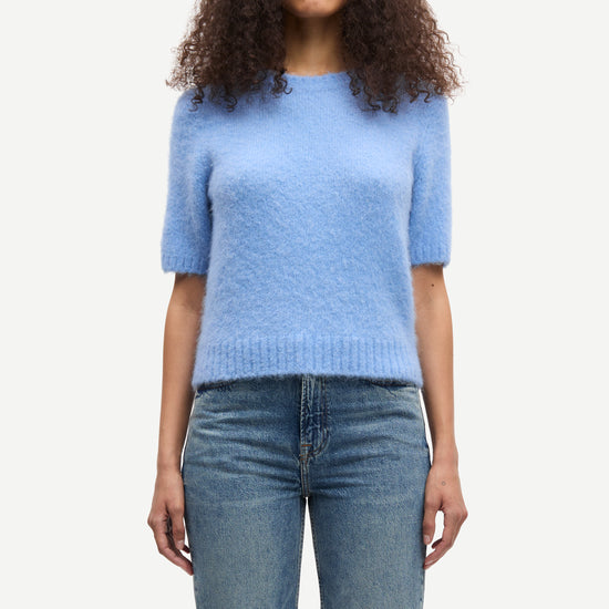 round neck short sleeve light blue jumper with rib detailing and cropped fit model shot