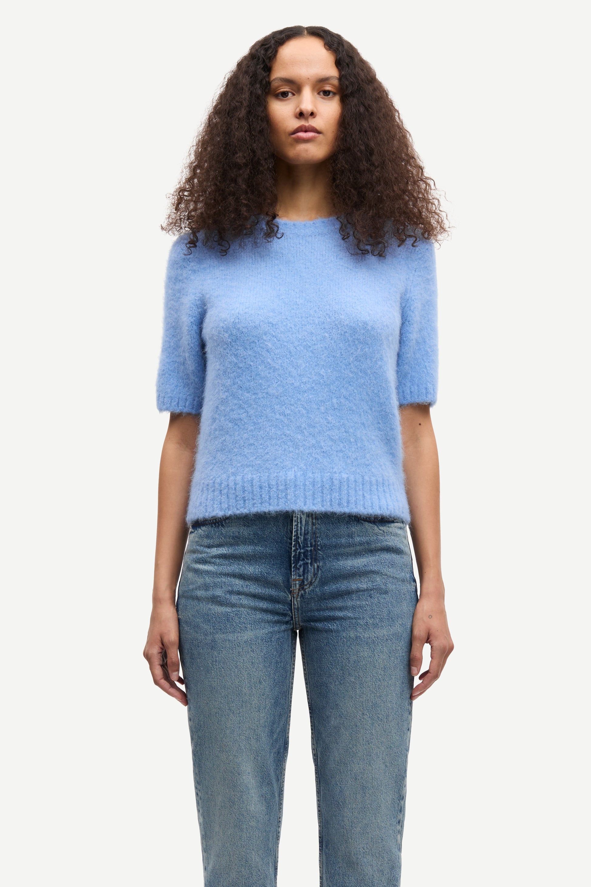 round neck short sleeve light blue jumper with rib detailing and cropped fit model shot