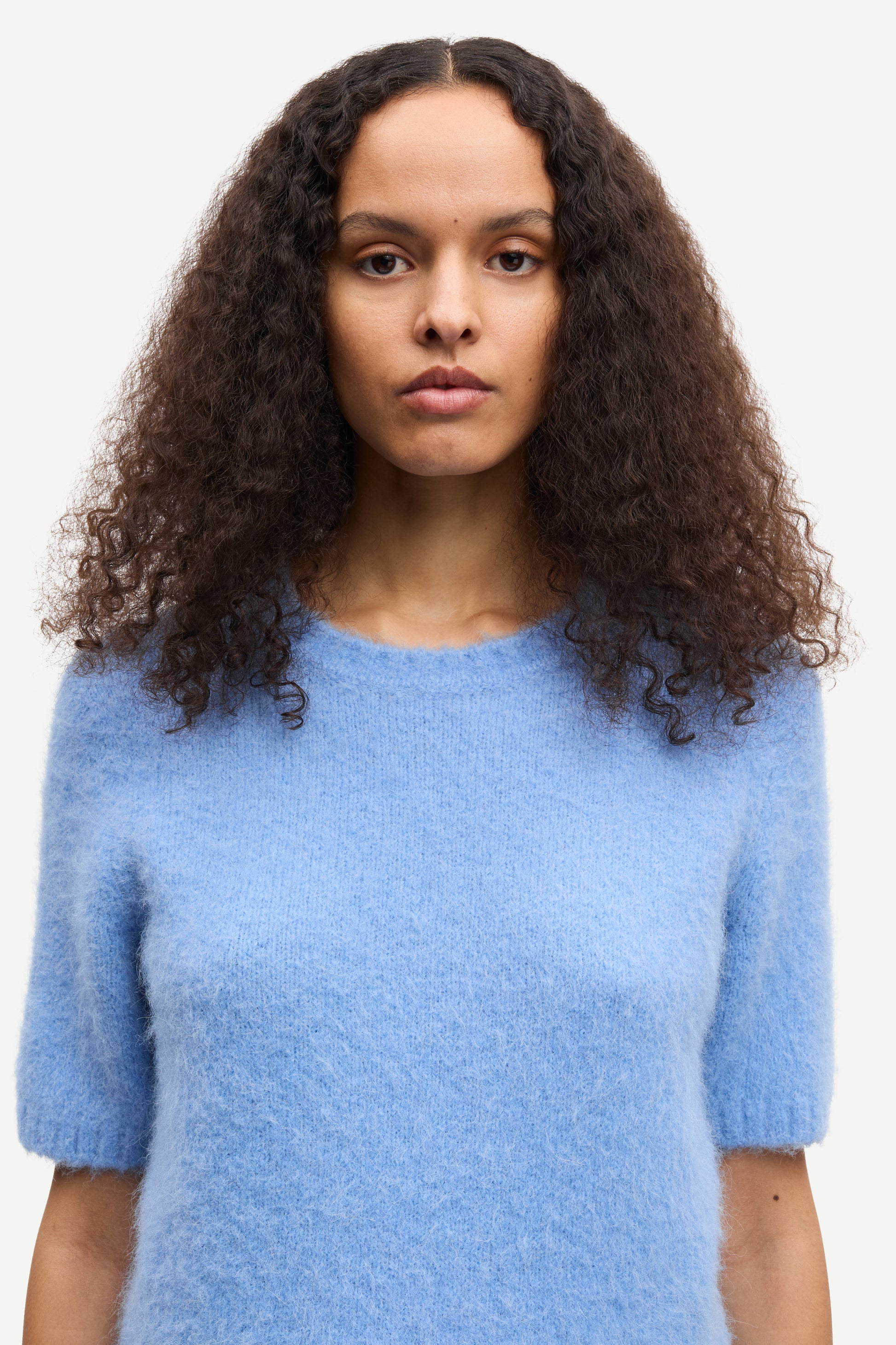 round neck short sleeve light blue jumper with rib detailing and cropped fit close up