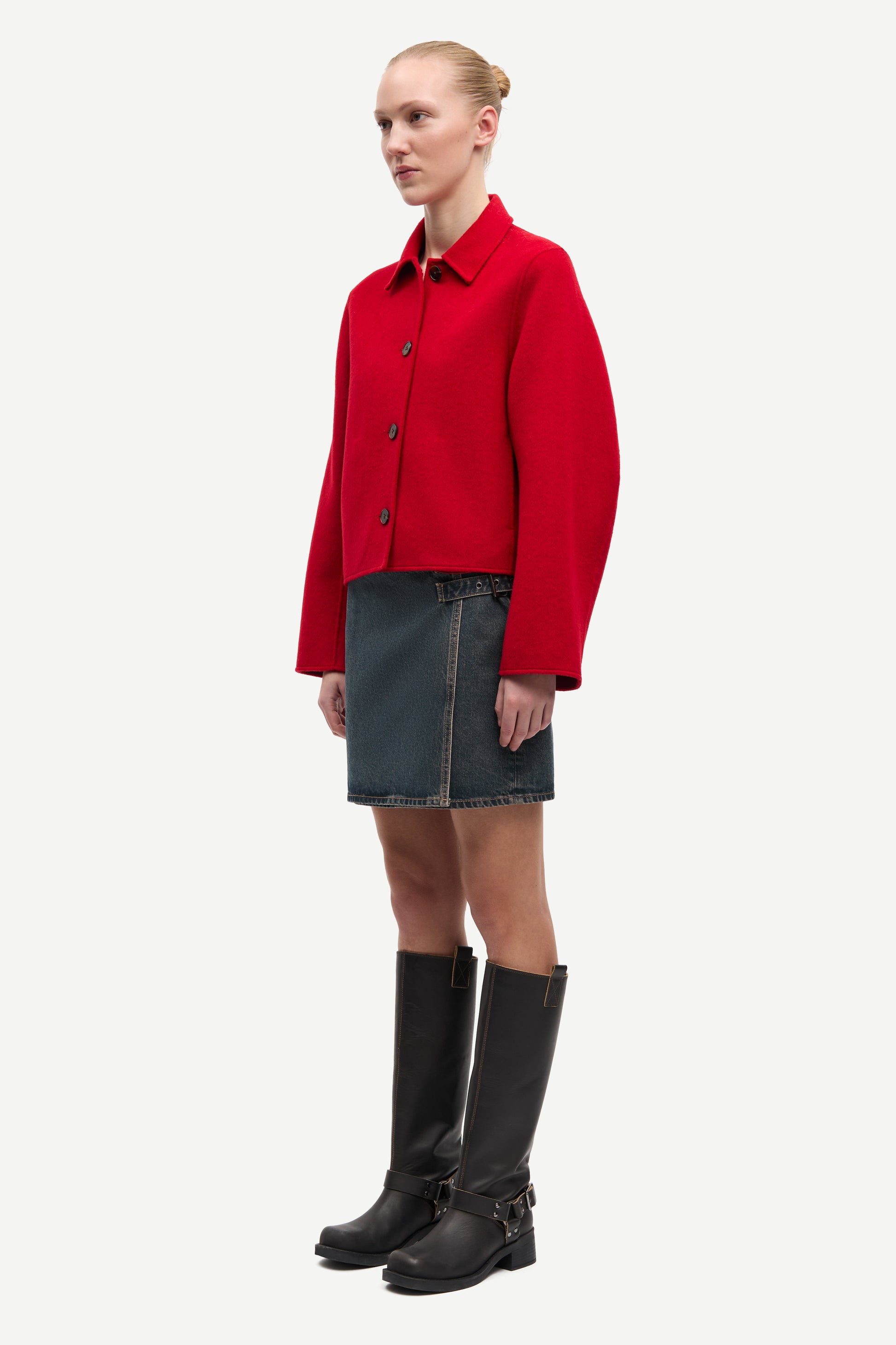 red boxy wool jacket with classic collar, black buttons and slightly cropped fit side view 