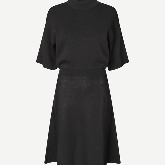 black short dress with flutter sleeves and waterfall skirt