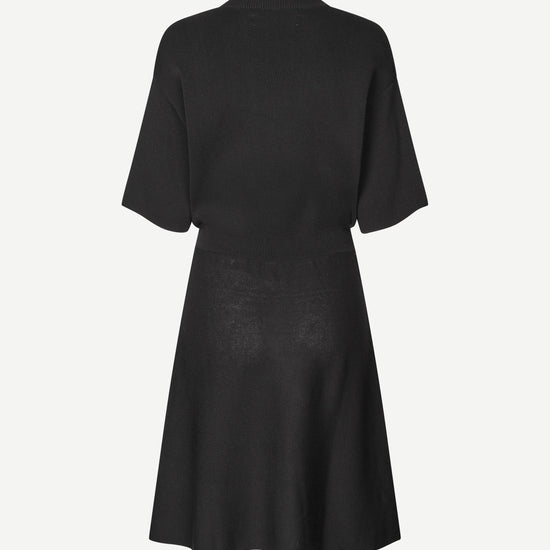 black short dress with flutter sleeves and waterfall skirt rear view