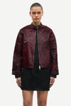 brown leather jacket with buckle at the neck and boxy fit model shot
