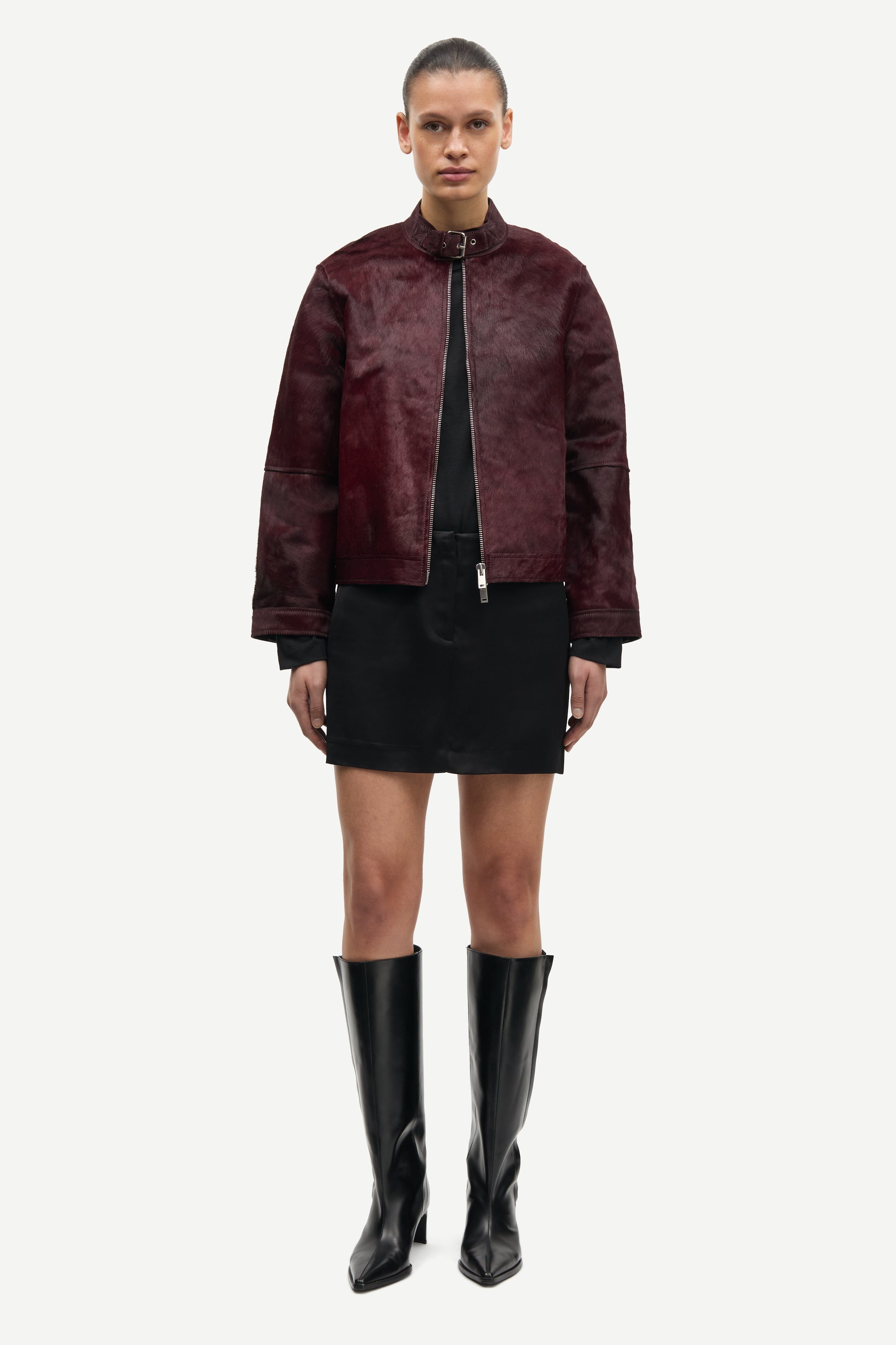 brown leather jacket with buckle at the neck and boxy fit model shot