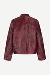 brown leather jacket with buckle at the neck and boxy fit rear view 