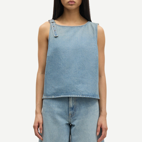 blue cotton tank top with belt detail on one shoulder and cut in a denim style close up