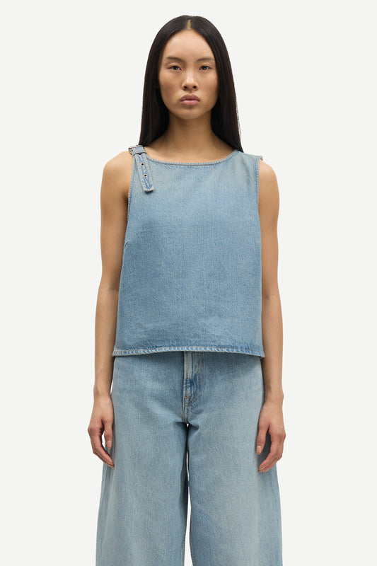 blue cotton tank top with belt detail on one shoulder and cut in a denim style close up