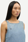 blue cotton tank top with belt detail on one shoulder and cut in a denim style close up