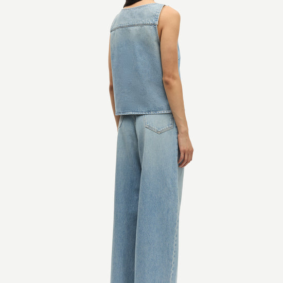 blue cotton tank top with belt detail on one shoulder and cut in a denim style rear view 